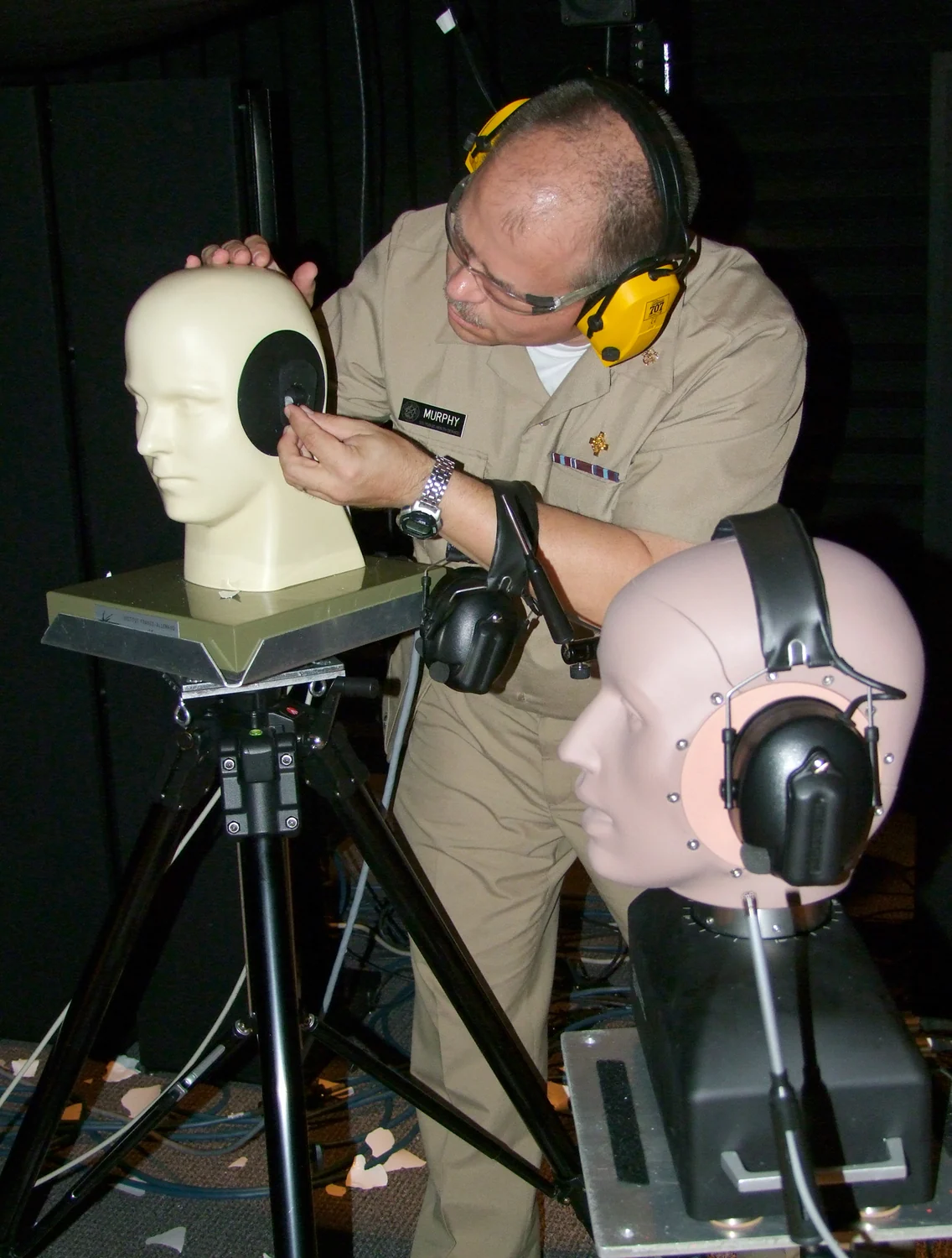 A NIOSH researcher tests hearing-protection devices using artificial head fixtures.
