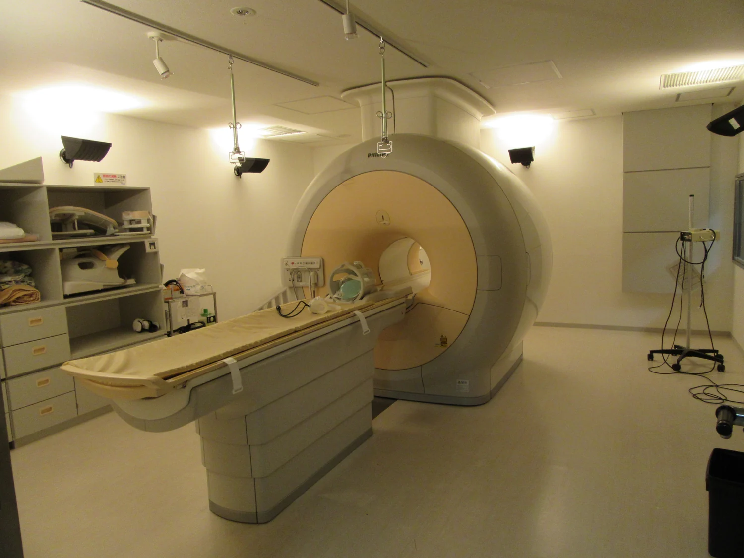 An MRI scanner with its circular opening and patient table.